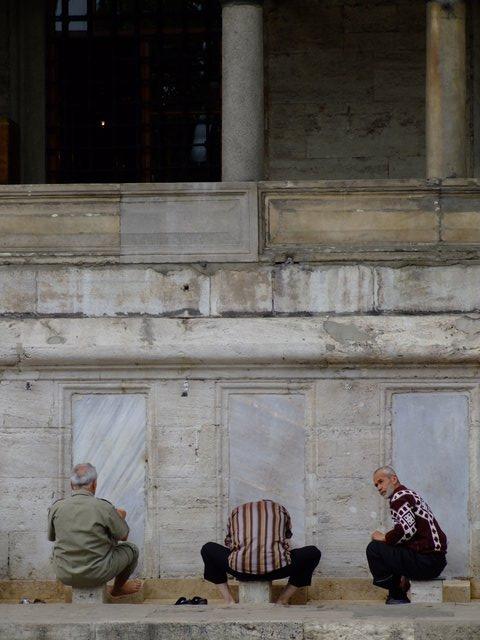 three men at the mosque
