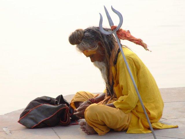 Sadhu, counting his money