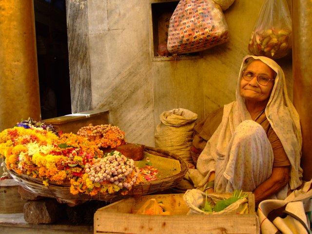 the lady sells flowers