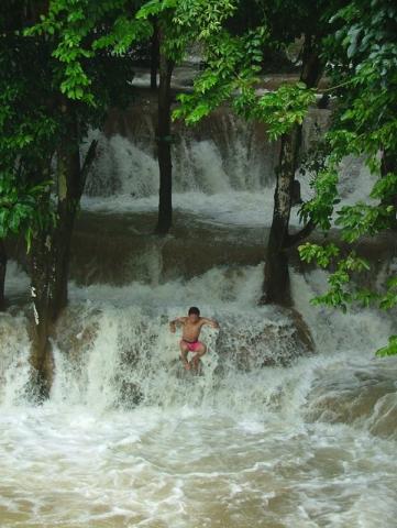 a boy in the waterfall
