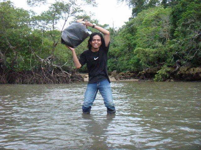 Hassan and a bag of rubbish