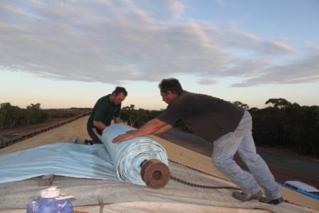 rolling the tarp over